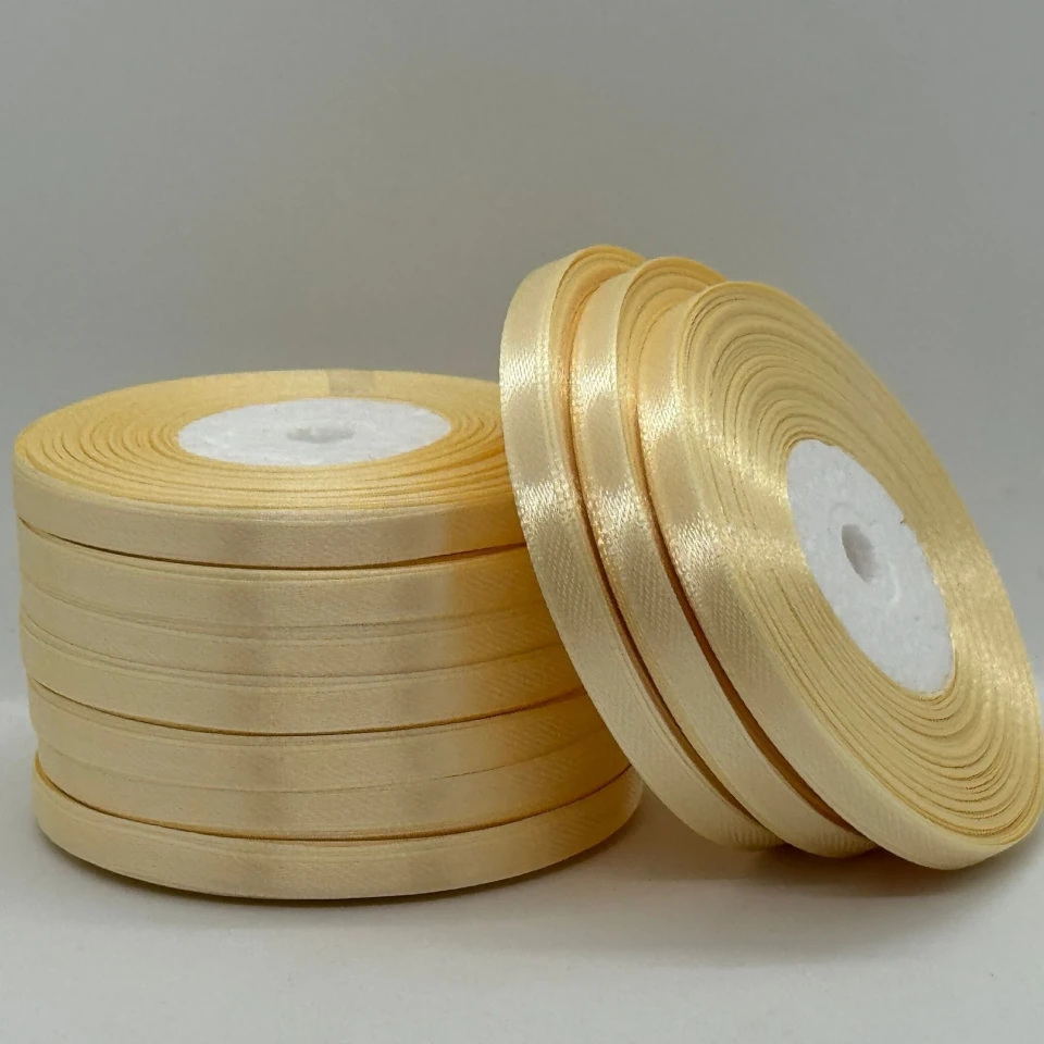 Атласная лента 0.6 см (33 м.), 02 темний молочний